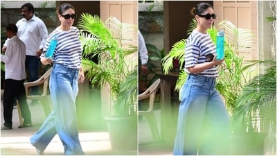 Kareena wore a casual cotton tee for the outing. It features a blue and white horizontal stripe pattern, a round neckline, half-length sleeves, drop shoulders, and a relaxed fit. The actor tucked her T-shirt inside the pants to add definition to the baggy blouse. Meanwhile, she paired the top with acid-wash denim jeans in a light blue shade. (HT Photo/Varinder Chawla) Kareena wore a casual cotton tee for the outing. It features a blue and white horizontal stripe pattern, a round neckline, half-length sleeves, drop shoulders, and a relaxed fit. The actor tucked her T-shirt inside the pants to add definition to the baggy blouse. Meanwhile, she paired the top with acid-wash denim jeans in a light blue shade. (HT Photo/Varinder Chawla)