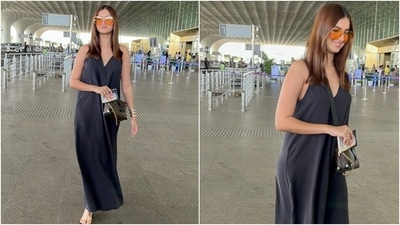 Tara's black maxi dress features spaghetti shoulder straps, a V neckline, a relaxed silhouette, and an ankle-length hem. The cotton dress is an excellent pick for your travel plans or beach vacation, so remember to steal some styling tips. The actor styled it with orange-tinted retro-style sunglasses, an over-the-body Louis Vuitton monogram mini bag, and gold strappy sandals. (HT Photo/Varinder Chawla) Tara's black maxi dress features spaghetti shoulder straps, a V neckline, a relaxed silhouette, and an ankle-length hem. The cotton dress is an excellent pick for your travel plans or beach vacation, so remember to steal some styling tips. The actor styled it with orange-tinted retro-style sunglasses, an over-the-body Louis Vuitton monogram mini bag, and gold strappy sandals. (HT Photo/Varinder Chawla)