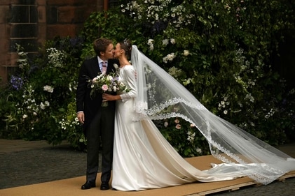 Groom Hugh Grosvenor, Duke of Westminster, and bride Olivia Henson kiss as they leave after their wedding service at Chester Cathedral in Chester, northern England. (AFP) Groom Hugh Grosvenor, Duke of Westminster, and bride Olivia Henson kiss as they leave after their wedding service at Chester Cathedral in Chester, northern England. (AFP)