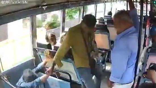 Kerala bus conductor held the passenger's hand tightly and saved him from falling off the moving bus. (X/@paganhindu)