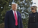 Donald Trump speaks to members of the media next to Melania Trump, right, before boarding Marine One on the South Lawn of the White House in Washington, D.C., U.S., on Wednesday, Jan. 20, 2021 . Photographer: Al Drago/Bloomberg