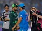 Pakistan's Babar Azam shakes hands with India's Rohit Sharma after India vs Pakistan match in Ahmedabad