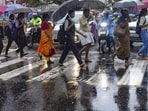 Kochi: Pedestrians hold umbrellas as they cross a street amid rains, in Kochi, Wednesday, May 29, 2024. India Meteorological Department (IMD) has forecasted very heavy rainfall in five districts of Kerala in the coming hours. (PTI Photo) Kochi: Pedestrians hold umbrellas as they cross a street amid rains, in Kochi, Wednesday, May 29, 2024. India Meteorological Department (IMD) has forecasted very heavy rainfall in five districts of Kerala in the coming hours. (PTI Photo)