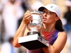 Poland's Iga Swiatek poses for a picture with the trophy after winning her final match against Italy's Jasmine Paolini