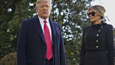 Donald Trump speaks to members of the media next to Melania Trump, right, before boarding Marine One on the South Lawn of the White House in Washington, D.C., U.S., on Wednesday, Jan. 20, 2021 . Photographer: Al Drago/Bloomberg (Bloomberg) Donald Trump speaks to members of the media next to Melania Trump, right, before boarding Marine One on the South Lawn of the White House in Washington, D.C., U.S., on Wednesday, Jan. 20, 2021 . Photographer: Al Drago/Bloomberg (Bloomberg)
