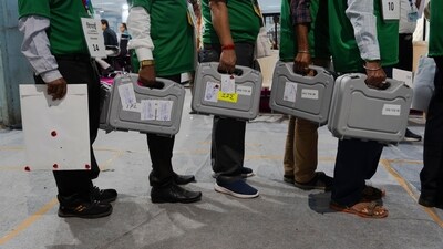 Election officials carry sealed electronic voting machines at a counting center in Mumbai, India, Tuesday, June 4, 2024. India on Tuesday started counting votes from its staggered, six-week election that was seen as a referendum on Prime Minister Narendra Modi's decade in power and was expected to give him a third term in office. (AP Photo/Rafiq Maqbool) (AP) Election officials carry sealed electronic voting machines at a counting center in Mumbai, India, Tuesday, June 4, 2024. India on Tuesday started counting votes from its staggered, six-week election that was seen as a referendum on Prime Minister Narendra Modi's decade in power and was expected to give him a third term in office. (AP Photo/Rafiq Maqbool) (AP)