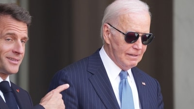 Emmanuel Macron, France's president, left, gestures towards US President Joe Biden and at the Elysee Palace in Paris, France, on Saturday, June 8, 2024. (Bloomberg)