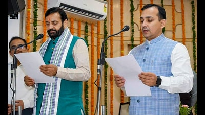 Haryana chief minister Nayab Saini administer the oath to advocate Himmat Singh as Haryana Staff Selection Commission chairman on Saturday. (PTI)
