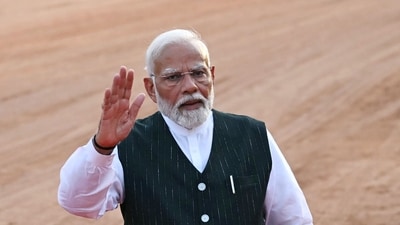 India's Prime Minister Narendra Modi waves to the crowd before his speech, after staking claim to form the new union government as he was elected for his third term following the country's general election, at the presidential palace Rashtrapati Bhavan in New Delhi on June 7, 2024. Prime Minister Narendra Modi thanked the people of India on June 7, for returning him to power after he was invited to form a new government by President Droupadi Murmu. (Photo by Money SHARMA / AFP) (AFP) India's Prime Minister Narendra Modi waves to the crowd before his speech, after staking claim to form the new union government as he was elected for his third term following the country's general election, at the presidential palace Rashtrapati Bhavan in New Delhi on June 7, 2024. Prime Minister Narendra Modi thanked the people of India on June 7, for returning him to power after he was invited to form a new government by President Droupadi Murmu. (Photo by Money SHARMA / AFP) (AFP)