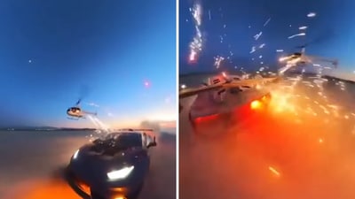 The image shows a glimpse from a now-deleted video of fireworks being shot at a Lamborghini from a helicopter. YouTuber Alex Choi shared the video. (Screengrab) The image shows a glimpse from a now-deleted video of fireworks being shot at a Lamborghini from a helicopter. YouTuber Alex Choi shared the video. (Screengrab)