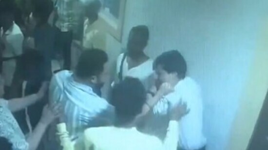 Screen grab from a video shared by BJP shows TMC's Soham Chakraborty allegedly attacking the restaurant owner. (X/BJP West Bengal)
