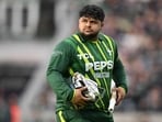 Pakistan's Azam Khan walks back to the pavilion having lost his wicket without scoring during the fourth T20 international cricket match