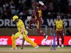 West Indies wicket keeper Nicholas Pooran jumps into the air in celebration as his teammate Akeal Hosein bowled out Uganda's Dineshkumar Nakrani, left, for a duck during an ICC Men's T20 World Cup cricket match at Guyana National Stadium West Indies wicket keeper Nicholas Pooran jumps into the air in celebration as his teammate Akeal Hosein bowled out Uganda's Dineshkumar Nakrani, left, for a duck during an ICC Men's T20 World Cup cricket match at Guyana National Stadium