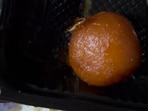 Cockroach roaming on gulab jamun given in a meal by IRCTC. 