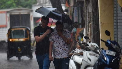 People going through the rain early in the morning at Bhandup in Mumbai. (HT photo) People going through the rain early in the morning at Bhandup in Mumbai. (HT photo)