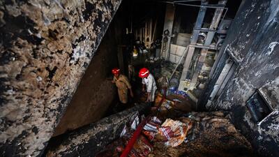 A view of fire fighters trying to douse the fire on Saturday. (Raj K Raj/HT PHOTO) A view of fire fighters trying to douse the fire on Saturday. (Raj K Raj/HT PHOTO)