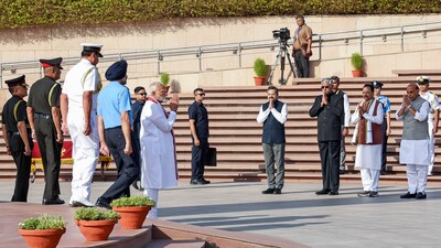Narendra Modi, accompanied by top military officials, acknowledges defence minister Rajnath Singh and others after honouring at the National War Memorial before his third consecutive term oath ceremony in New Delhi. (X/@narendramodi) Narendra Modi, accompanied by top military officials, acknowledges defence minister Rajnath Singh and others after honouring at the National War Memorial before his third consecutive term oath ceremony in New Delhi. (X/@narendramodi)