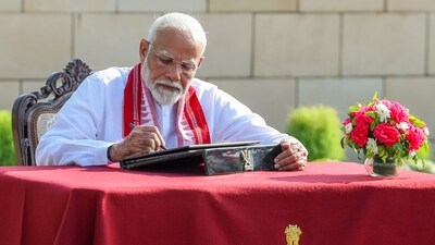 Modi inscribes his thoughts in Visitors' Book at the National War Memorial in New Delhi. (BJP Media) Modi inscribes his thoughts in Visitors' Book at the National War Memorial in New Delhi. (BJP Media)