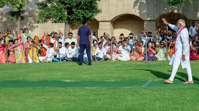 After honouring Mahatma Gandhi on Sunday, Modi acknowledges the people with a gesture in New Delhi. (BJP Media) After honouring Mahatma Gandhi on Sunday, Modi acknowledges the people with a gesture in New Delhi. (BJP Media)