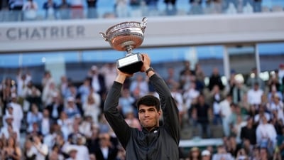 Winner Spain's Carlos Alcaraz celebrates with the trophy as he won the men's final match of the French Open tennis tournament against Germany's Alexander Zverev at the Roland Garros stadium in Paris (AP) Winner Spain's Carlos Alcaraz celebrates with the trophy as he won the men's final match of the French Open tennis tournament against Germany's Alexander Zverev at the Roland Garros stadium in Paris (AP)