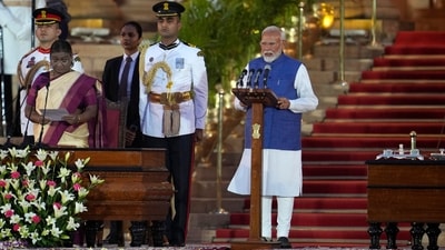 Narendra Modi, right, is sworn-in as the Prime Minister of India by President Draupadi Murmu, left, at the Rashtrapati Bhawan, in New Delhi, India, Sunday, June 9, 2024. The 73-year-old leader is only the second Indian prime minister to retain power for a third term. (AP Photo/Manish Swarup) (AP)