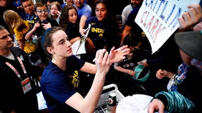 FILE - Indiana Fever guard Caitlin Clark signs autographs for fans before the start of WNBA basketball game against the New York Liberty, Saturday, May 18, 2024, in New York. (AP Photo/Noah K. Murray, File) (AP) FILE - Indiana Fever guard Caitlin Clark signs autographs for fans before the start of WNBA basketball game against the New York Liberty, Saturday, May 18, 2024, in New York. (AP Photo/Noah K. Murray, File) (AP)