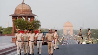 Delhi Police personnel patrol Raisina Hill ahead of the swearing-in ceremony. (Arvind Yadav/HT Photo) Delhi Police personnel patrol Raisina Hill ahead of the swearing-in ceremony. (Arvind Yadav/HT Photo)