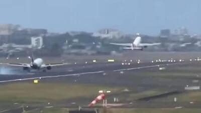 In the video, the Air India flight was seen taking off and the IndiGo flight descended towards the runway. (X/ @Deepak Sharma) In the video, the Air India flight was seen taking off and the IndiGo flight descended towards the runway. (X/ @Deepak Sharma)