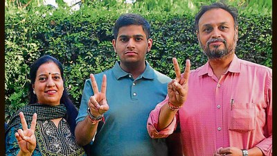 Keshav Dharni with his parents after the announcement of JEE Advanced results, in Ludhiana on Sunday. (Manish/HT) Keshav Dharni with his parents after the announcement of JEE Advanced results, in Ludhiana on Sunday. (Manish/HT)
