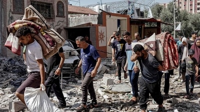 Aid delivered to Gaza from newly repaired US-built pier (Photo by Bashar TALEB / AFP) (AFP) Aid delivered to Gaza from newly repaired US-built pier (Photo by Bashar TALEB / AFP) (AFP)