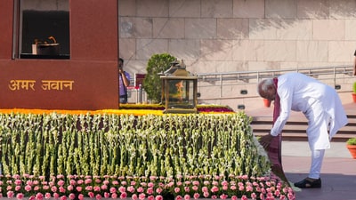 Modi lays a wreath at the National War Memorial in New Delhi on Sunday. (PTI) Modi lays a wreath at the National War Memorial in New Delhi on Sunday. (PTI)