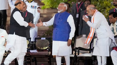 Prime Minister Narendra Modi being greeted by BJP MP Rajnath Singh at the swearing-in ceremony of the new Union government, at Rashtrapati Bhavan in New Delhi, Sunday. (PTI) Prime Minister Narendra Modi being greeted by BJP MP Rajnath Singh at the swearing-in ceremony of the new Union government, at Rashtrapati Bhavan in New Delhi, Sunday. (PTI)