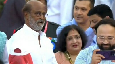 Rajinikanth was accompanied by his wife Latha. He opted for a simple white kurta to attend the oath-taking ceremony. (ANI) Rajinikanth was accompanied by his wife Latha. He opted for a simple white kurta to attend the oath-taking ceremony. (ANI)