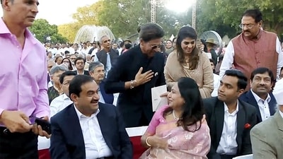 Shah Rukh Khan looked dapper as ever in a dark suit and sunglasses, making heads turn with his cool look. He was accompanied by Mukesh and Anant Ambani. (ANI) Shah Rukh Khan looked dapper as ever in a dark suit and sunglasses, making heads turn with his cool look. He was accompanied by Mukesh and Anant Ambani. (ANI)