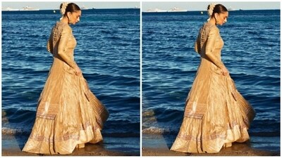 Her outfit comes in a mesmerising shade of gold and features a full-sleeved kurta with stunning gold intricate sequin zari hand embroidery adorning the neck and borders. She paired it with a matching tissue skirt for a complete royal look. (Instagram/@aditiraohydari) Her outfit comes in a mesmerising shade of gold and features a full-sleeved kurta with stunning gold intricate sequin zari hand embroidery adorning the neck and borders. She paired it with a matching tissue skirt for a complete royal look. (Instagram/@aditiraohydari)