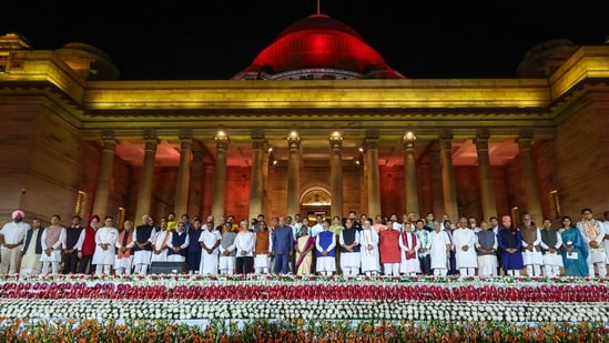 President Droupadi Murmu and Vice President Jagdeep Dhankhar with Prime Minister Narendra Modi and other ministers at the swearing-in ceremony of new Union government, at Rashtrapati Bhavan in New Delhi, Sunday. (PTI)
