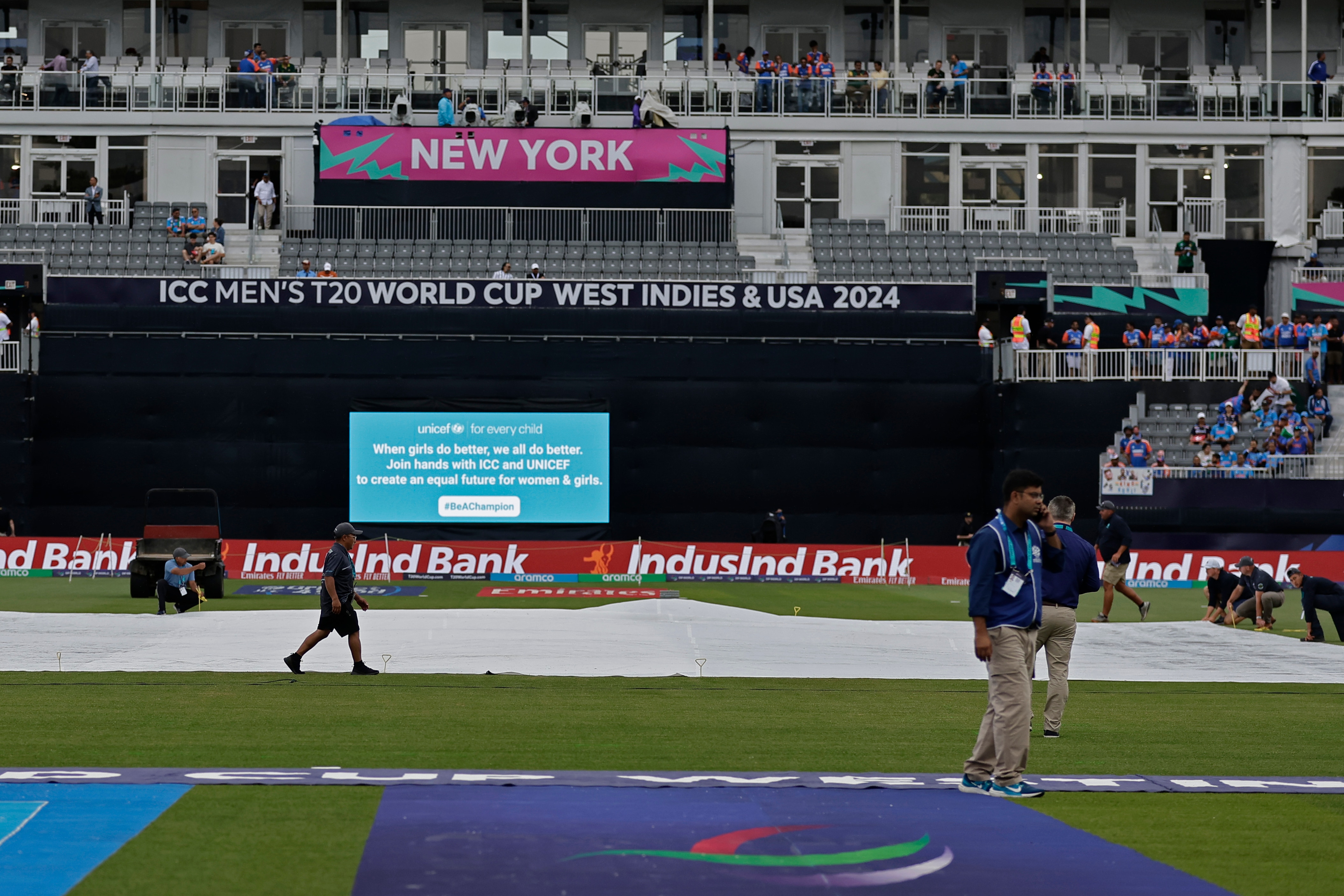 Groundsmen cover the pitch area as it drizzles prior to the start of the ICC Men's T20 World Cup cricket match between India and Pakistan at the Nassau County International Cricket Stadium in Westbury, New York, Sunday, June 9, 2024. (AP Photo/Adam Hunger) (AP) Groundsmen cover the pitch area as it drizzles prior to the start of the ICC Men's T20 World Cup cricket match between India and Pakistan at the Nassau County International Cricket Stadium in Westbury, New York, Sunday, June 9, 2024. (AP Photo/Adam Hunger) (AP)