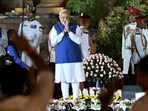 Prime Minister Narendra Modi gestures to the gathering during the oath-taking ceremony at Rashtrapati Bhavan.