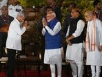 Bharatiya Janata Party (BJP) leader, S. Jaishankar greets Prime Minister Narendra Modi after he takes oath as a cabinet minister during the swearing-in ceremony of the NDA government.