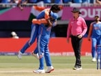 India's Hardik Pandya celebrates with captain Rohit Sharma after the dismissal of Pakistan's Shadab Khan.
