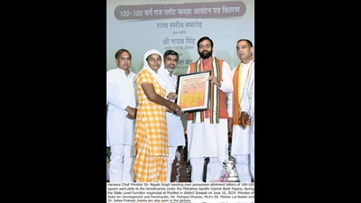 Haryana CM Nayab Singh Saini on Monday distributed 100-square yard plot possession certificates to eligible families under the Mahatma Gandhi Gramin Basti Yojana in Sonepat, assuring that the state government has also made a plan to provide plots to other poor beneficiaries. (HT)