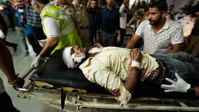 Reasi terror attack: An injured man is brought to the Government Medical College Hospital in Jammu after the bus he was traveling in fell into a deep gorge. (AP ) Reasi terror attack: An injured man is brought to the Government Medical College Hospital in Jammu after the bus he was traveling in fell into a deep gorge. (AP )