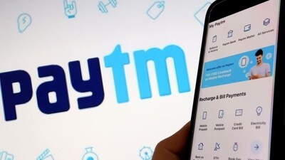 Paytm layoffs: The interface of payments app Paytm is seen in front of its logo displayed in this illustration picture. (Reuters)
