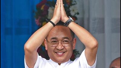 Prem Singh Tamang greets people after taking oath as the Sikkim chief minister during the swearing-in ceremony at Panjor Stadium in Gangtok on Monday. (ANI)