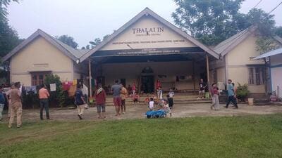 Residents of Manipur’s Jiribam district take shelter in an area in Assam’s Cachar district. (HT photo)