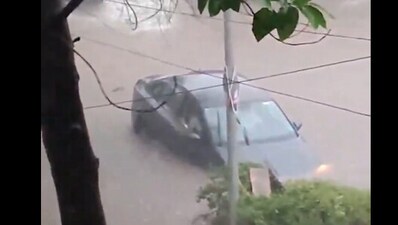 Pune woman stuck between water due to heavy rains in the city. Pune woman stuck between water due to heavy rains in the city.