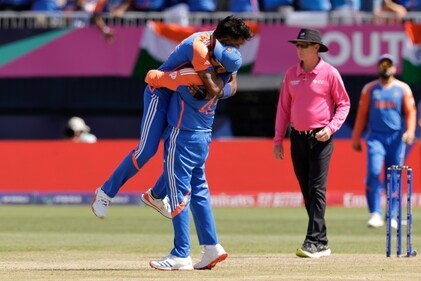 India's Hardik Pandya, left, celebrates with captain Rohit Sharma after the dismissal of Pakistan's Shadab Khan. (PTI)