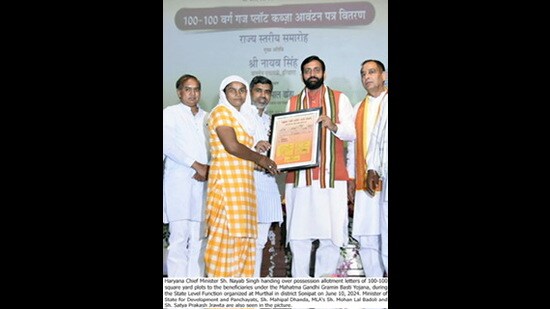 Haryana CM Nayab Singh Saini on Monday distributed 100-square yard plot possession certificates to eligible families under the Mahatma Gandhi Gramin Basti Yojana in Sonepat, assuring that the state government has also made a plan to provide plots to other poor beneficiaries. (HT)
