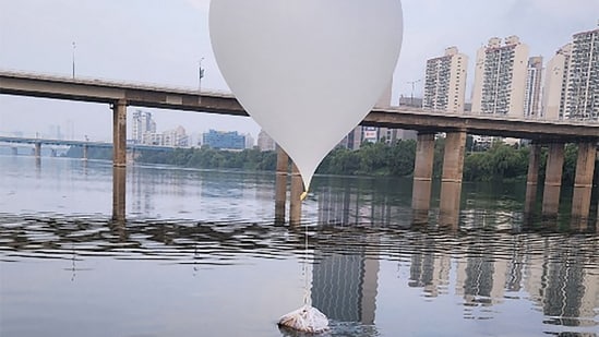 An unidentified object believed to be a North Korean trash-filled balloon, on the surface of the Han River near Jamsil Bridge in Seoul. (AFP)