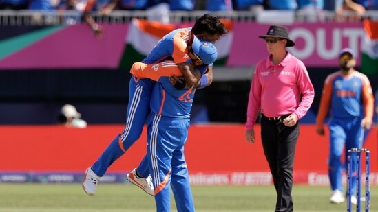 India's Hardik Pandya celebrates with captain Rohit Sharma after the dismissal of Pakistan's Shadab Khan. (AP)